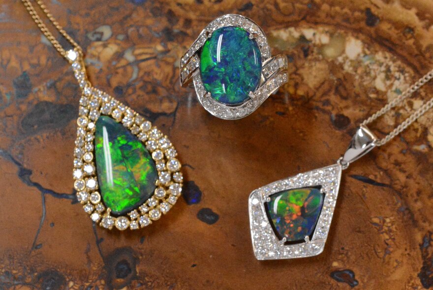 Two opal pendants and an opal ring. 
