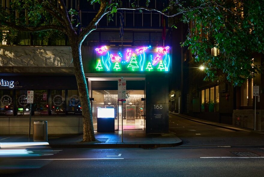 Light up display of six platypuses swimming. 