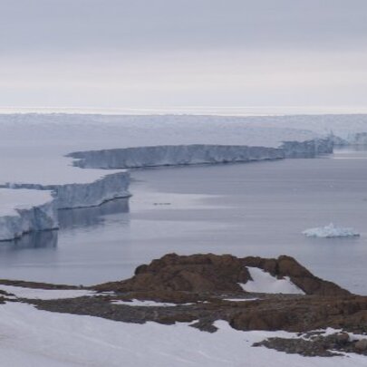 Still from a video by Polly Stanton, of an ice shelf and the sea at the Antarctic.