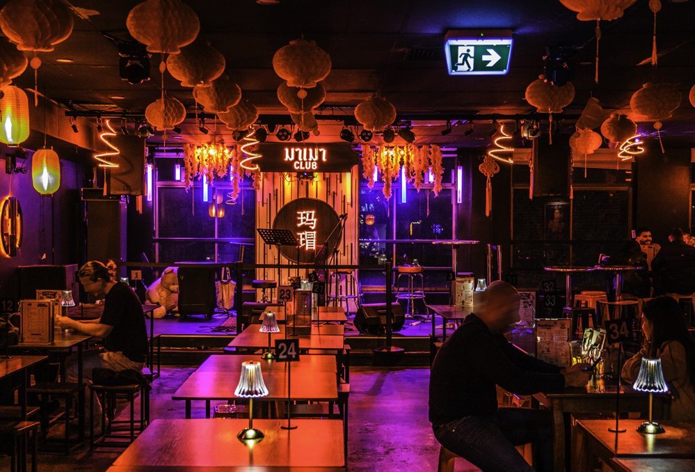 Inside a dimly-lit Thai-style nightclub