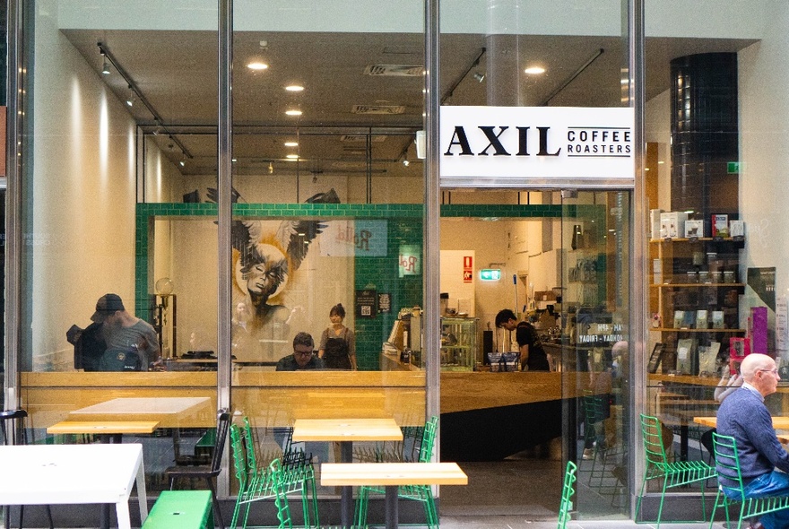 Exterior of Axil Coffee in Southern Cross Lane, with seats outside.