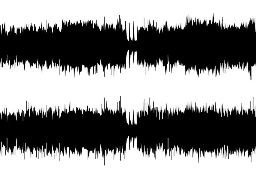 Black audio waveform with varying amplitude displayed on a white background.