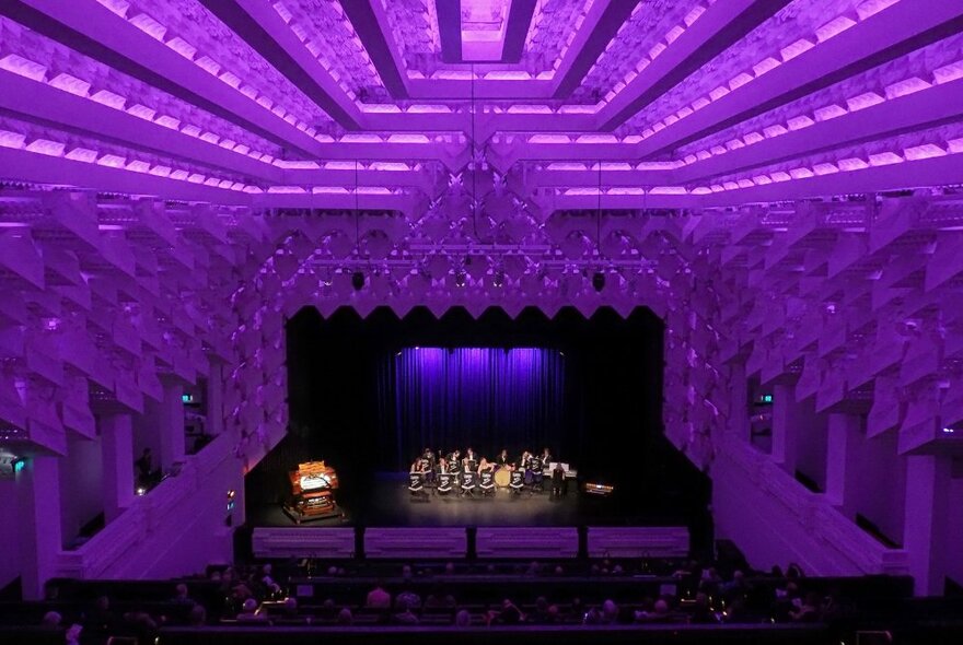 Purple-hued honeycomb decoration by Walter Burley Griffin on the ceiling and walls at the Capitol Theatre.