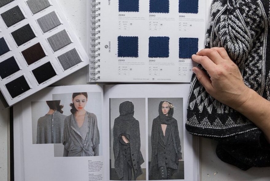 Photos of people modelling grey knitwear, a hand resting on patterned knitting and colour swags in tones of grey.