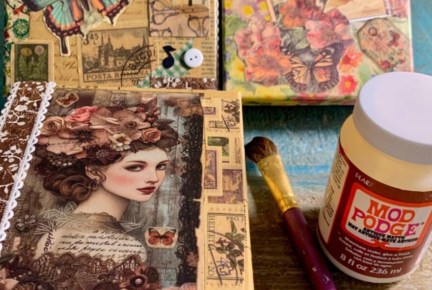 Boxes decorated with different patterned papers using the technique of decoupage.