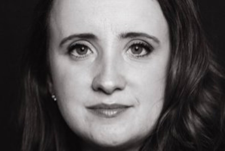 Close-up portrait of a woman with dark hair.
