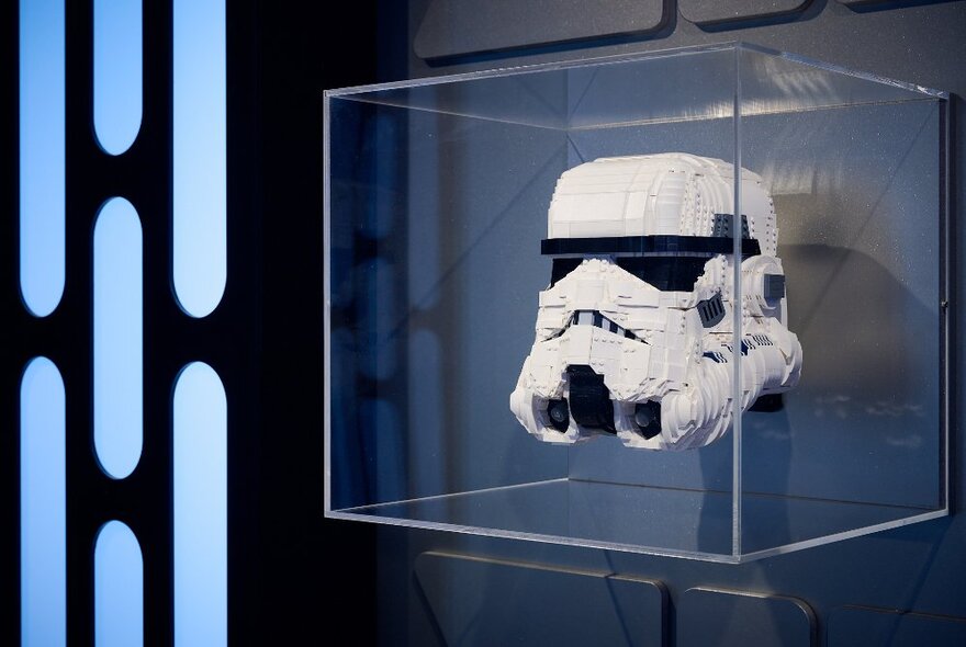 The white helmet of a Storm Trooper made from LEGO bricks, a wall mounted display as part of the Lego Star Wars exhibition.