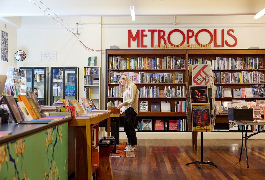 A woman browsing in a book shop.