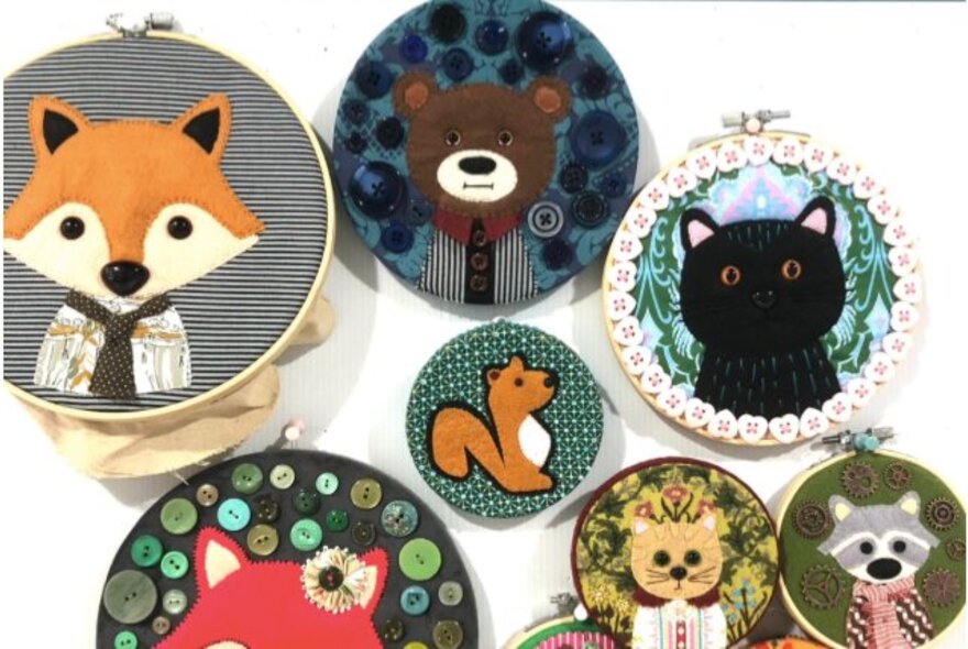 Examples of stitched hoop art featuring animals. 