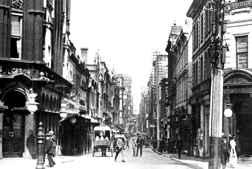 Vintage Melbourne street scene with Victorian-era buildings and horsedrawn carts.