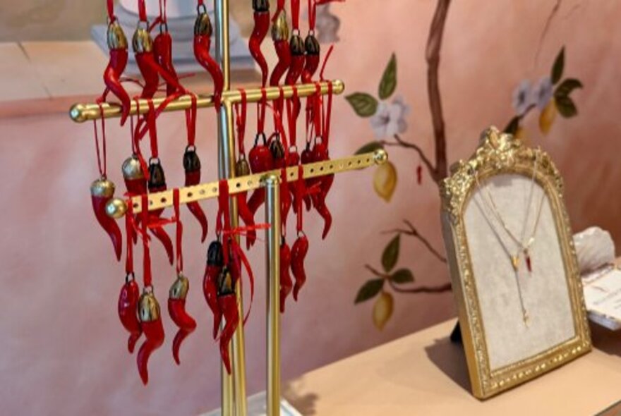 Rows of Italian pepper charms and frames.