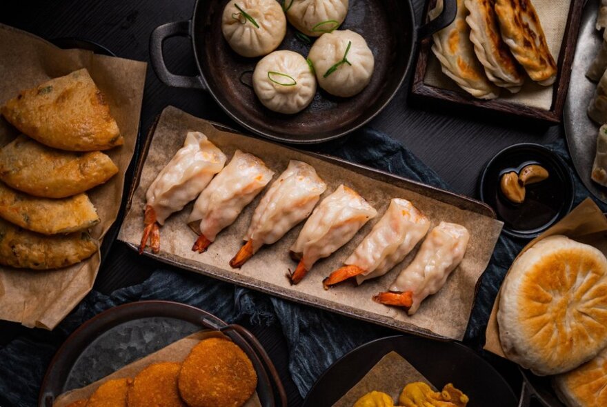 Trays of dumplings, fritters and other Chinese dishes.