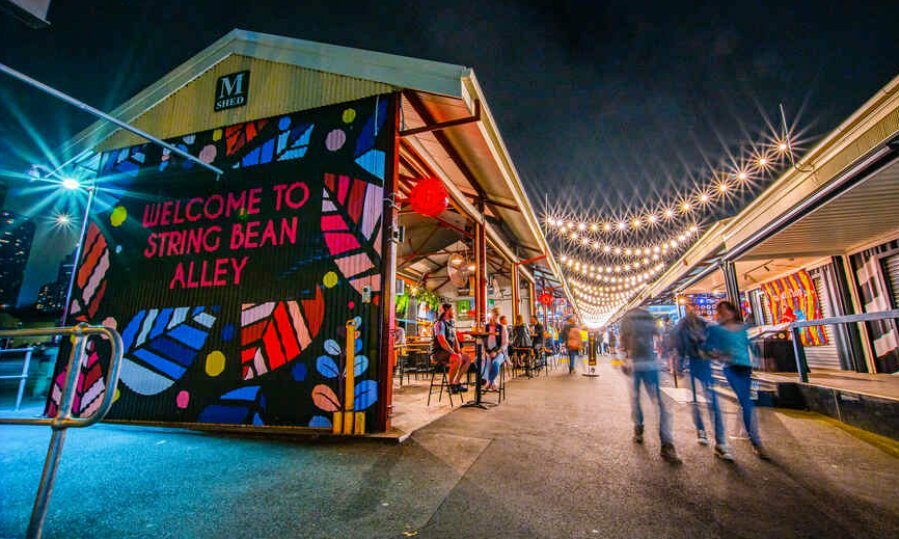 A laneway market lit up at night