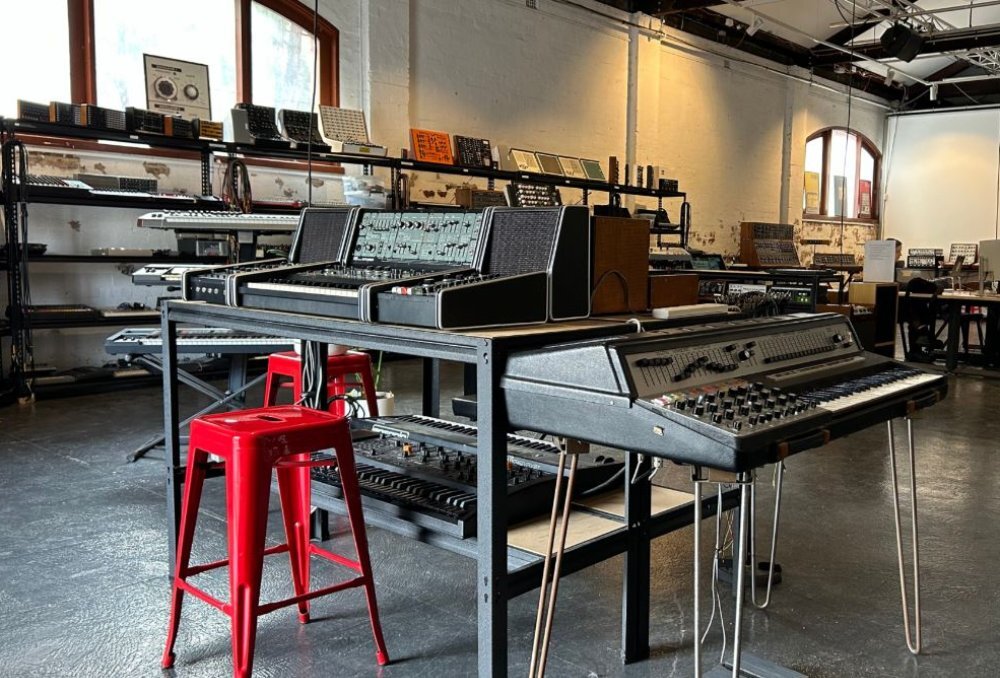 Inside a sound studio with electronic music equipment.