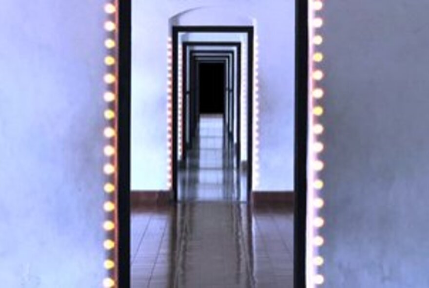 Purple walls and doors with corridors and lights leading to eternity.