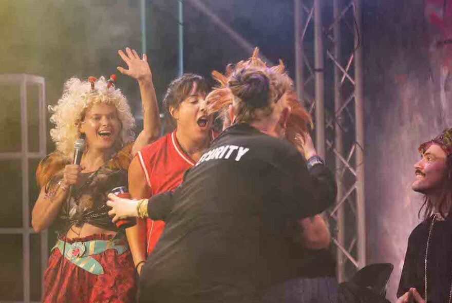 Actors on stage performing a show.
