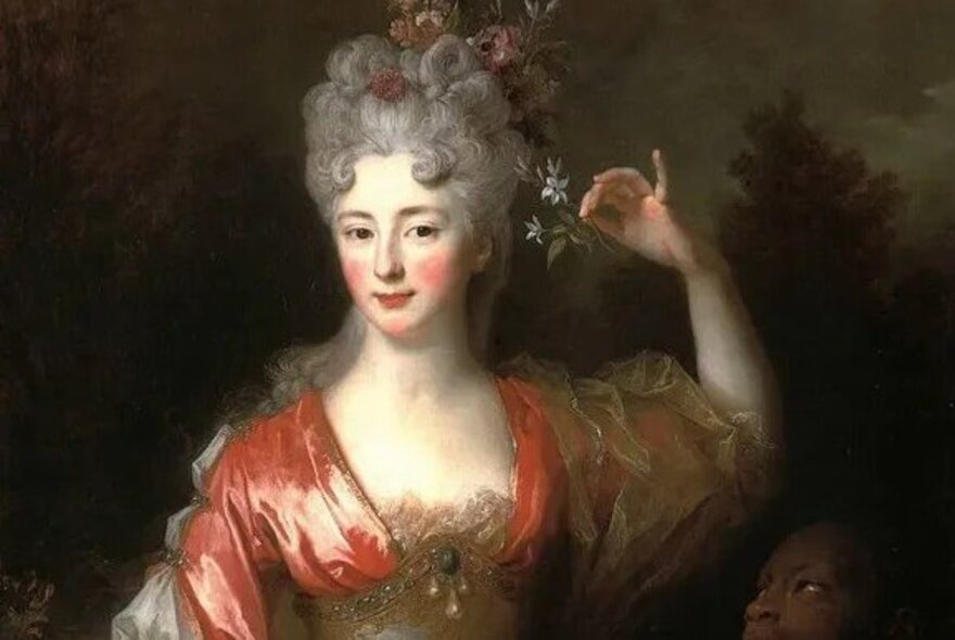 Painting of a woman with rosy cheeks, powdered grey wig and satin gown, from 18th century.