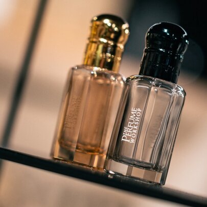 Two glass perfume bottles.