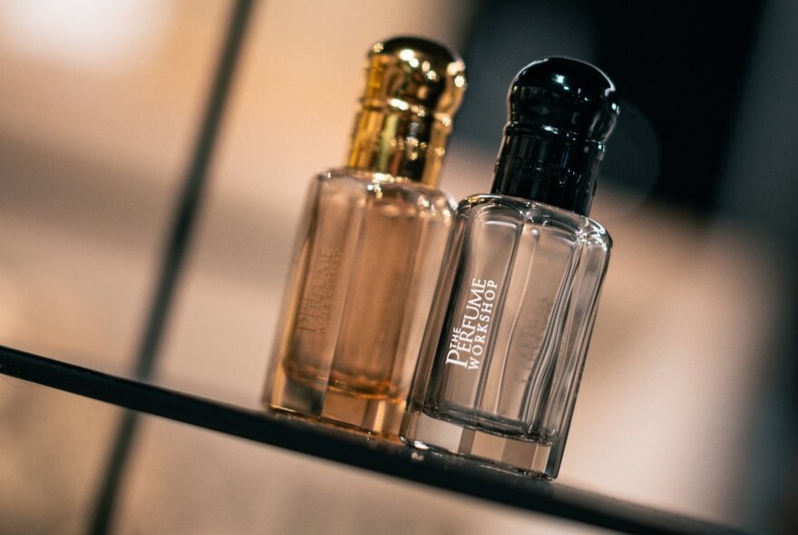 Two glass perfume bottles.