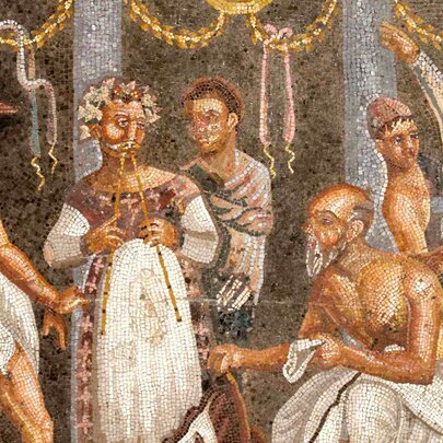 An ancient Roman mosaic showing a group of theatre actors and musicians preparing for a performance.