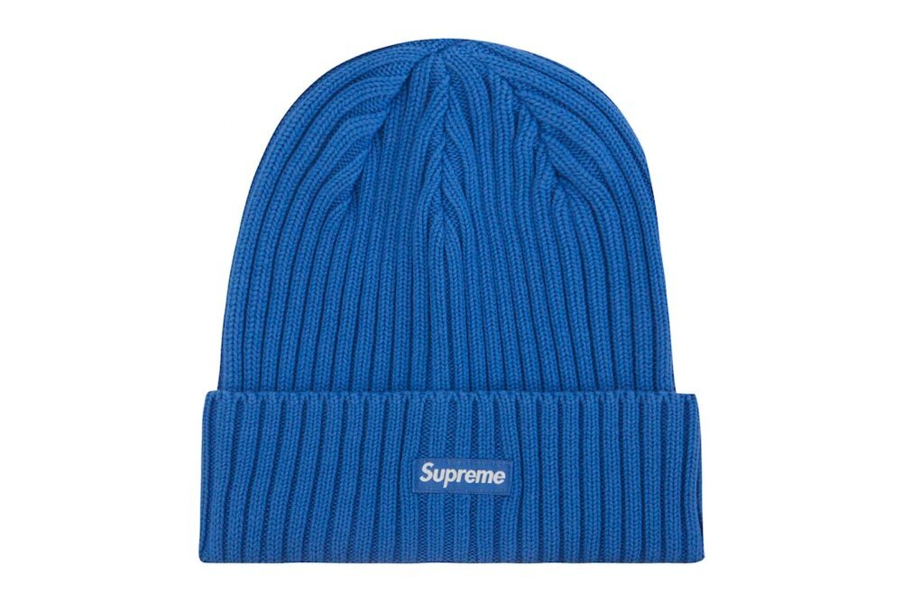 A bright blue ribbed beanie with a small Supreme logo.
