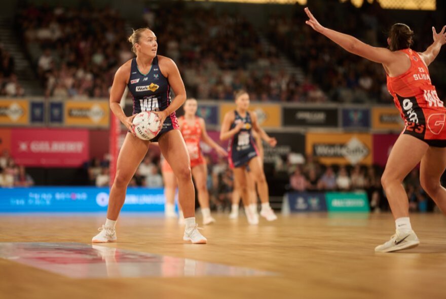 A netball match featuring the Melbourne Vixens and the Giants. 