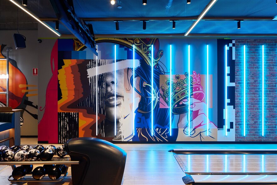 Kingpin Melbourne's bowling lanes decorated with vibrant murals.