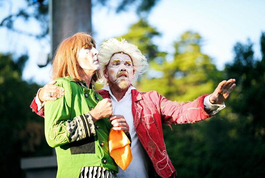 Two performers acting in a production of Twelfth Night, outdoors. 