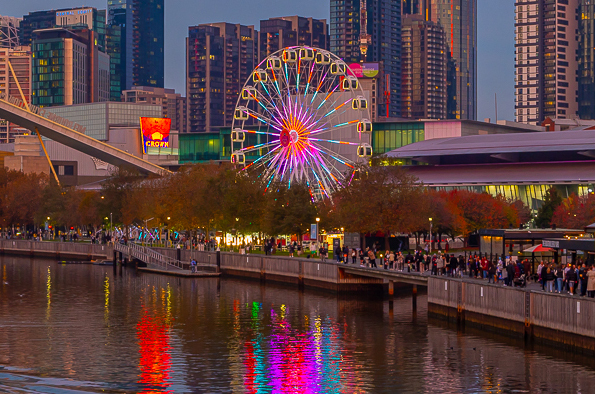 A waterwise Ferris wheel reflecting rainbow colours.