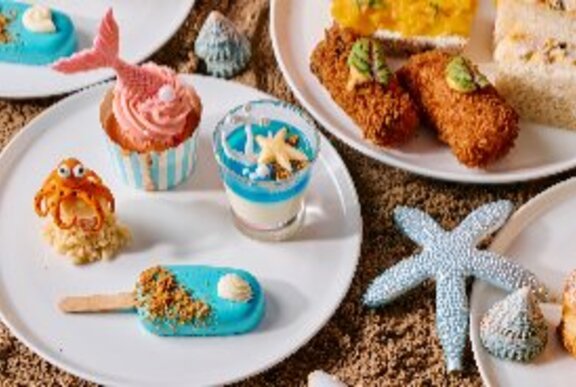Underwater-themed high tea items including starfish, fish and iced lolly shaped treats.