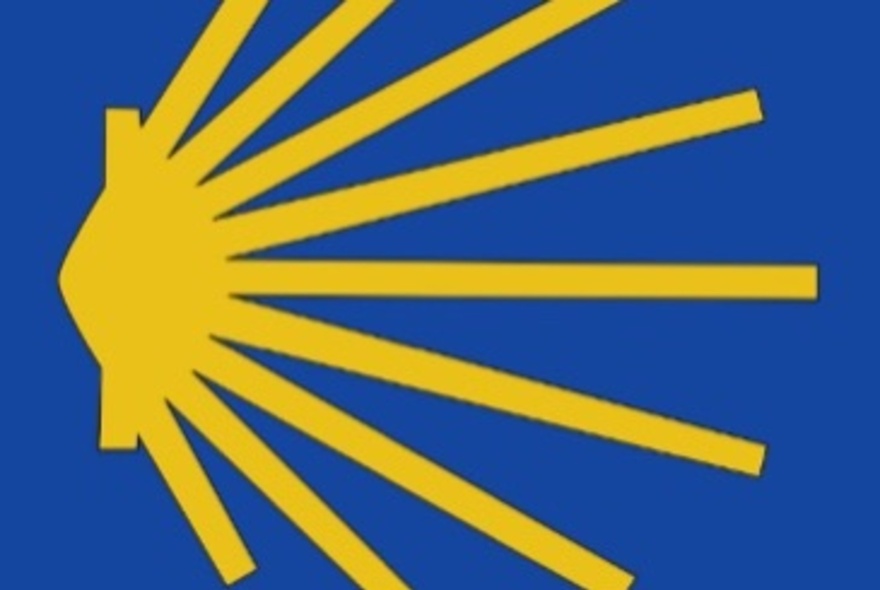 The modern emblem of the Camino de Santiago (Way of St. James), a stylised yellow pattern against a blue background.