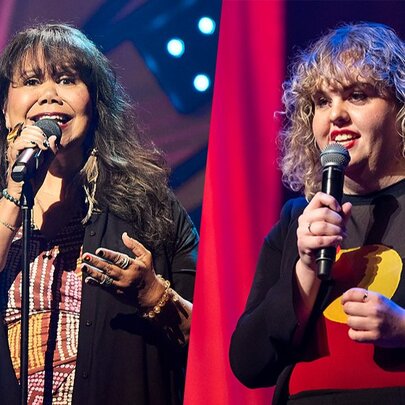 Two First Nations female comedians on stage delivering a routine. 