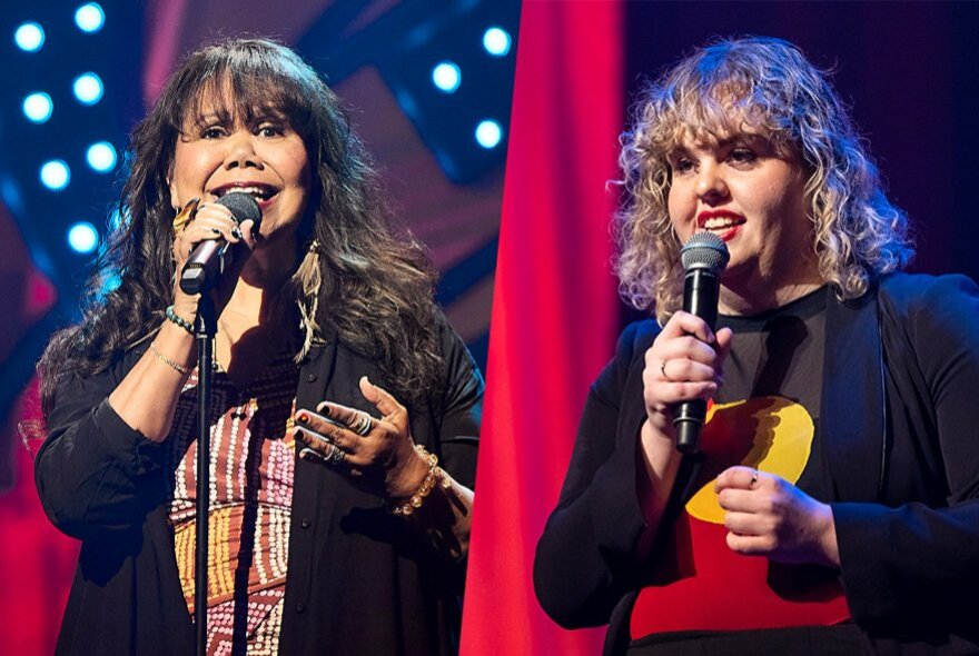 Two First Nations female comedians on stage delivering a routine. 