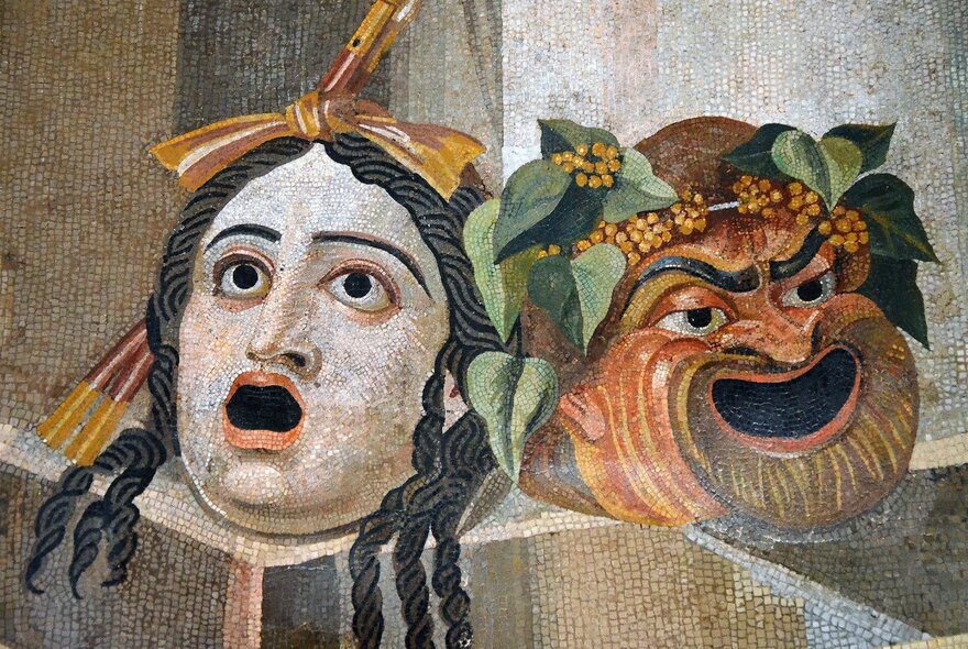 Mosaic depicting theatrical masks of tragedy and comedy.