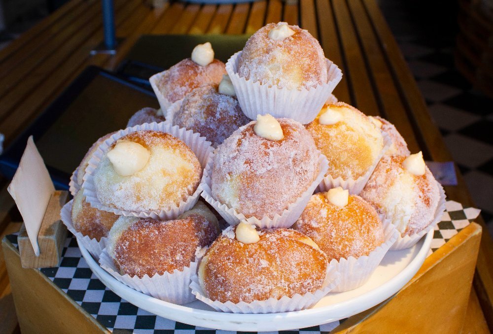 A plate of Italian doughnuts stacked on top of each other.
