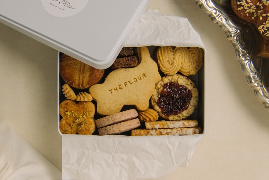 A box filled with a variety of small biscuits. 