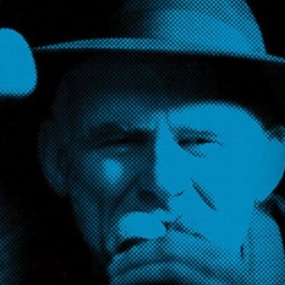 Blue-toned image of a man wearing a hat.