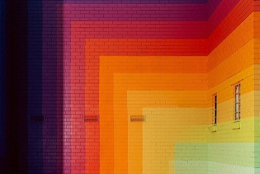 A rainbow-coloured brick wall.