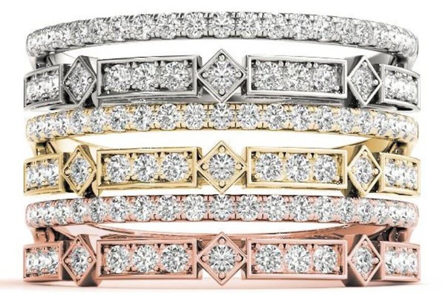 Stacked diamond rings in platinum, gold and rose gold.