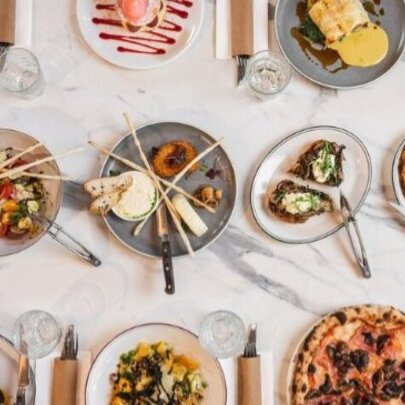 Three rows of neatly lined up dishes of Italian food.