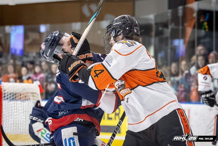 Ice hockey players on the ice during a game at O'Brien Icehouse.