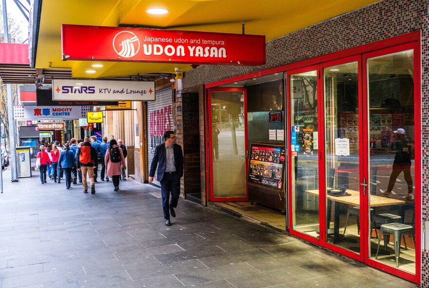 Outside an udon restaurant on a busy street