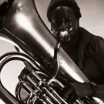 Musician playing a large tuba.