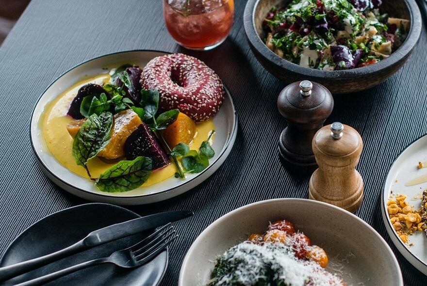 Salads, bagel and bowls of savoury food.