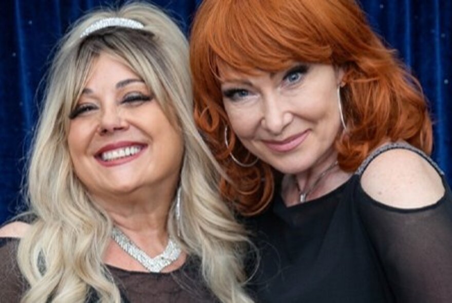 Two female singers, portraying country music icons, as part of the tribute show Dolly and Friends.