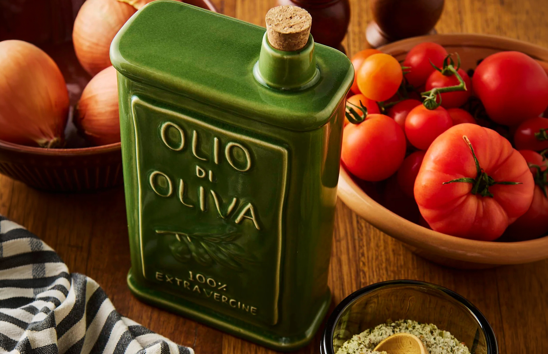 A ceramic olive oil can next to produce.