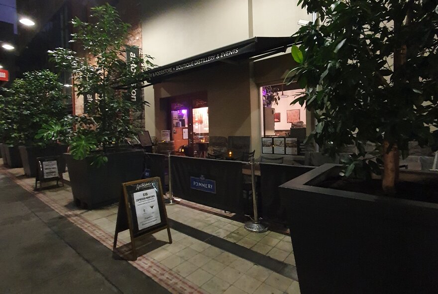 The exterior of Life's Too Short Bar showing a sandwich board sign on the footpath in front of the entrance.