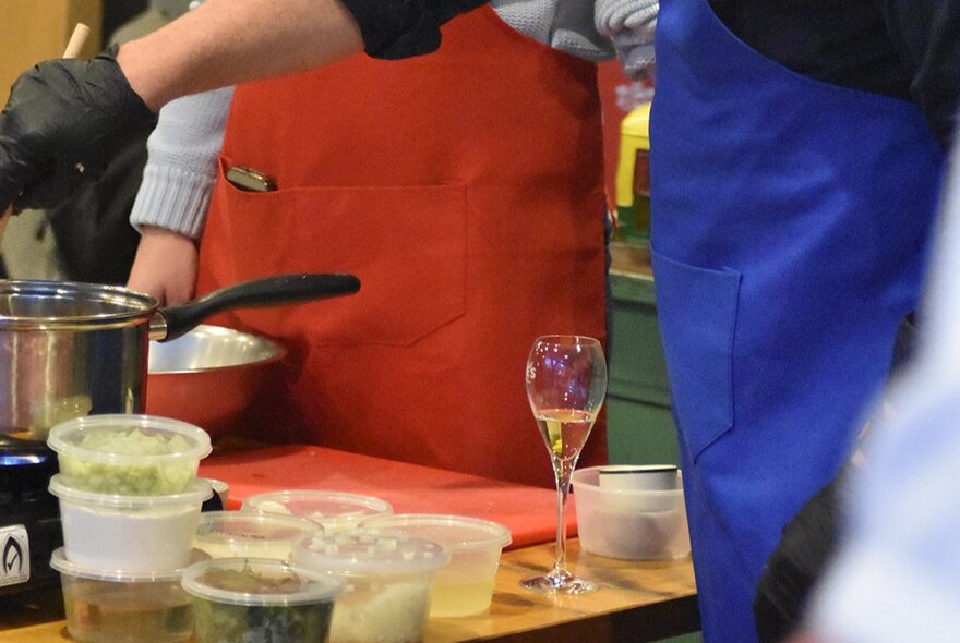 Ingredients and tools on a counter during a cooking workshop.
