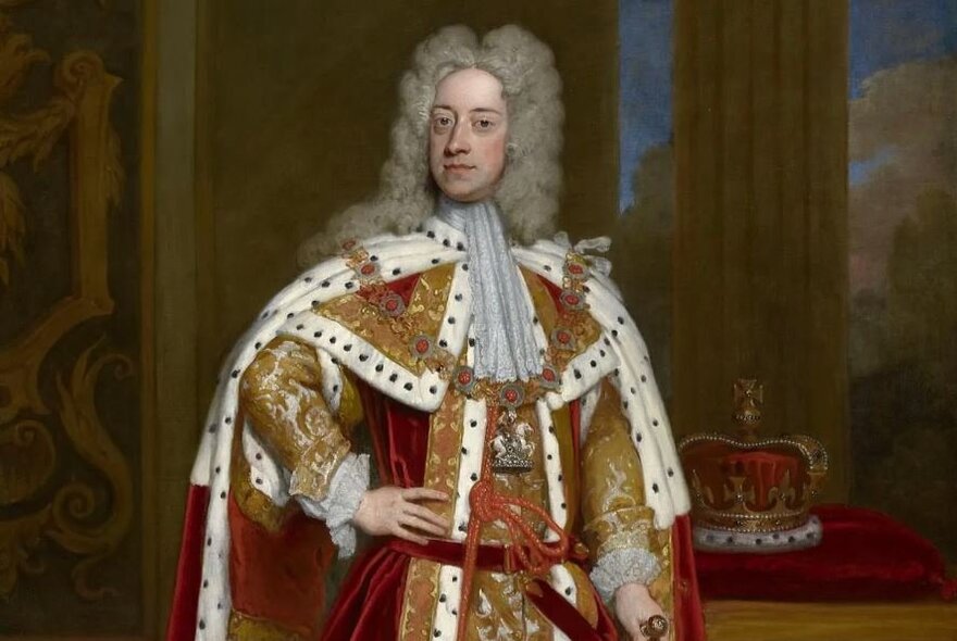 George II wearing a wig and gold and ermine elaborate robes.
