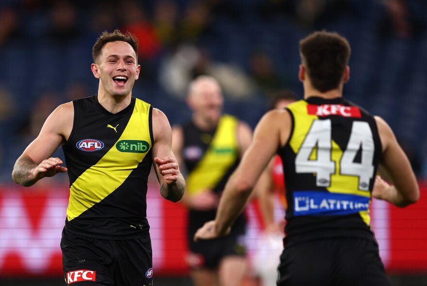 Richmond AFL football players on the field during a match.
